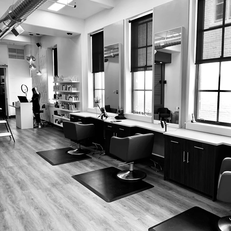 Stylists laughing together in the salon